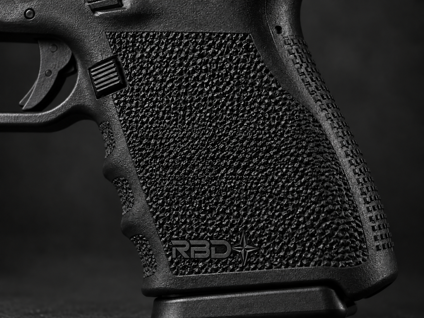 AI-generated concept of a black polymer handgun grip with custom stippling surrounding the RBD lettering and compass-star emblem